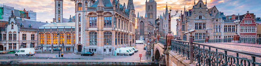 Ghent Panoramic view of the historic city center of Ghent with Leie river illuminated in beautiful twilight Ghent East Flanders Belgium 1000x667
